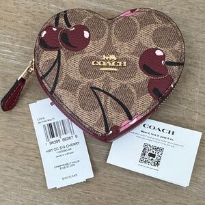 Coach NWT heart-shaped coin pouch w/signature cherries coated canvas w/red trim